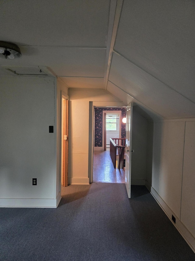 505 N Pine St, Evart, MI 49631 - additional living space featuring lofted ceiling and dark carpet