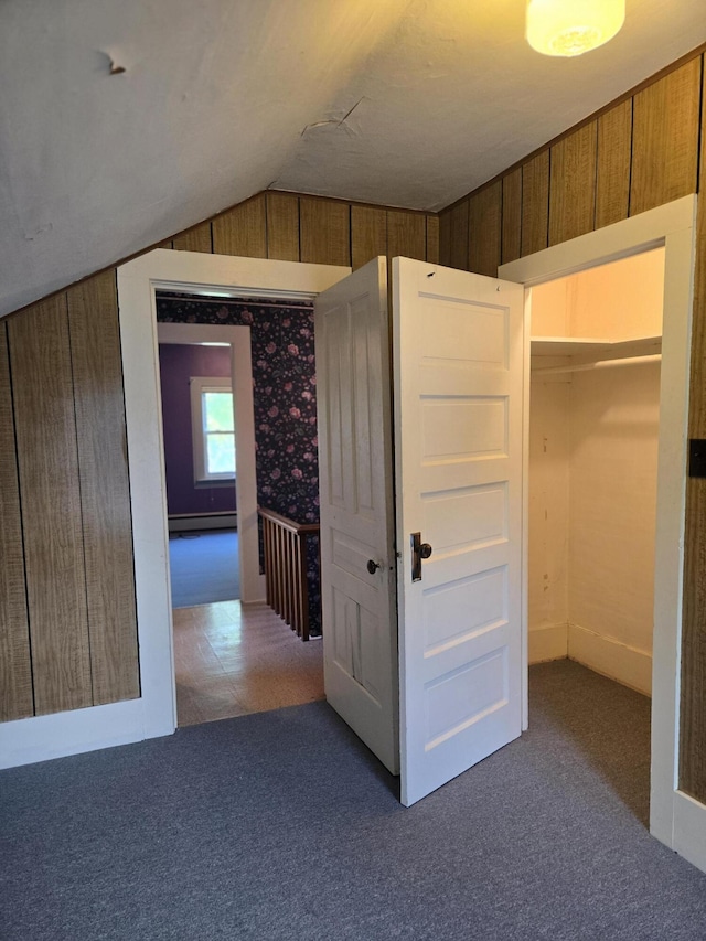 505 N Pine St, Evart, MI 49631 - hall featuring carpet, vaulted ceiling, and baseboard heating