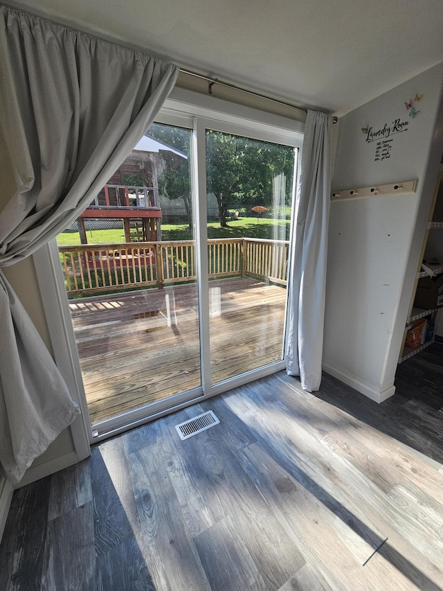 227 W Nelson St, Hastings, MI 49058 - doorway to outside with wood finished floors and baseboards