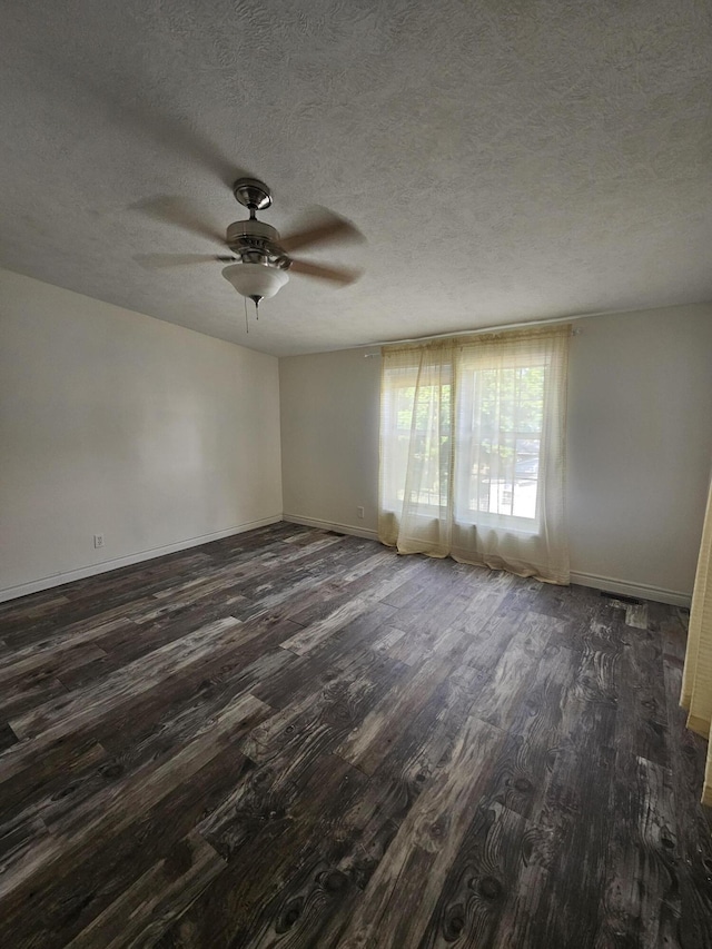 227 W Nelson St, Hastings, MI 49058 - spare room featuring dark wood finished floors, ceiling fan, and a textured ceiling