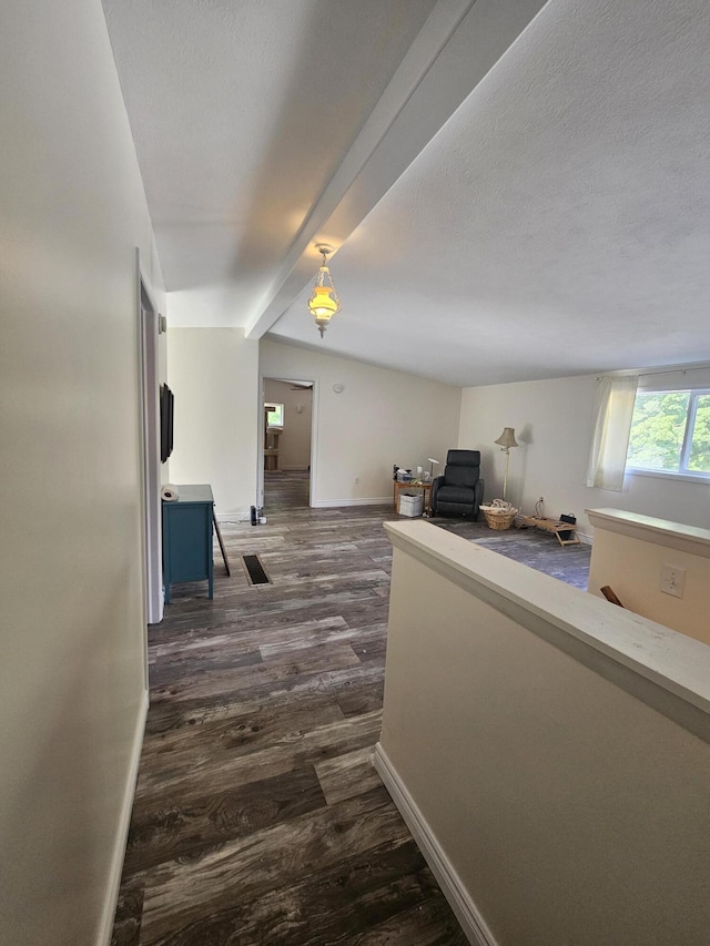 227 W Nelson St, Hastings, MI 49058 - hall featuring dark wood-style floors and beamed ceiling