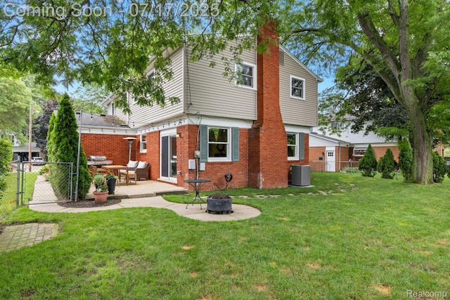455 Leicester St, Plymouth, MI 48170 - rear view of property with a gate, an outdoor fire pit, brick siding, a chimney, and a patio