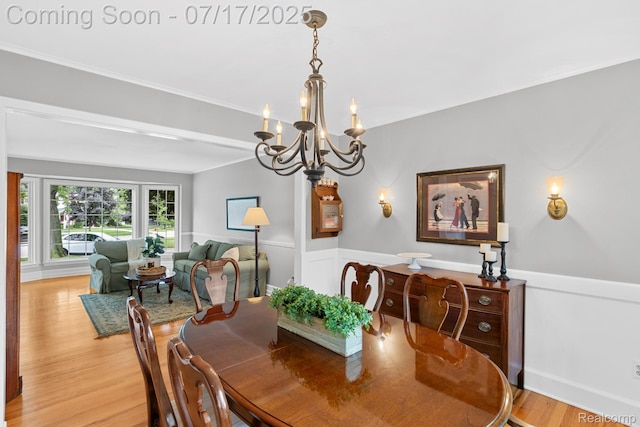 455 Leicester St, Plymouth, MI 48170 - dining area featuring a chandelier, light wood finished floors, wainscoting, and ornamental molding