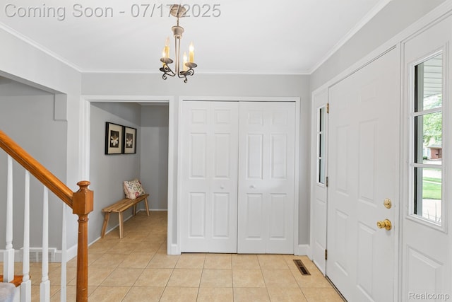 455 Leicester St, Plymouth, MI 48170 - entryway with light tile patterned floors, a chandelier, ornamental molding, and stairs