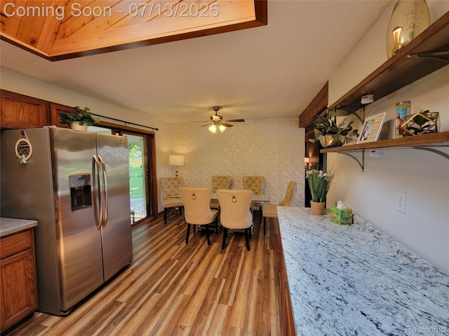 14373 Racho Blvd, Taylor, MI 48180 - dining space with light wood-type flooring, ceiling fan, and wallpapered walls