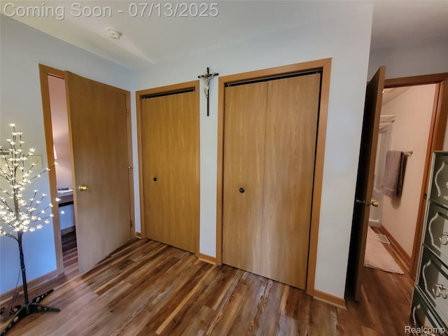 14373 Racho Blvd, Taylor, MI 48180 - unfurnished bedroom featuring two closets and wood finished floors