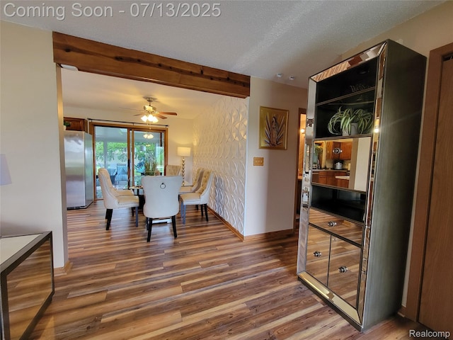14373 Racho Blvd, Taylor, MI 48180 - dining space featuring wood finished floors, ceiling fan, beam ceiling, and a textured ceiling
