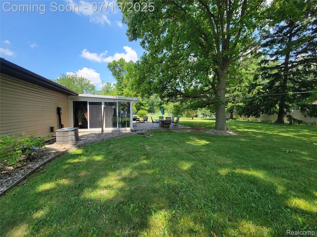 14373 Racho Blvd, Taylor, MI 48180 - view of green lawn with a sunroom and a patio area
