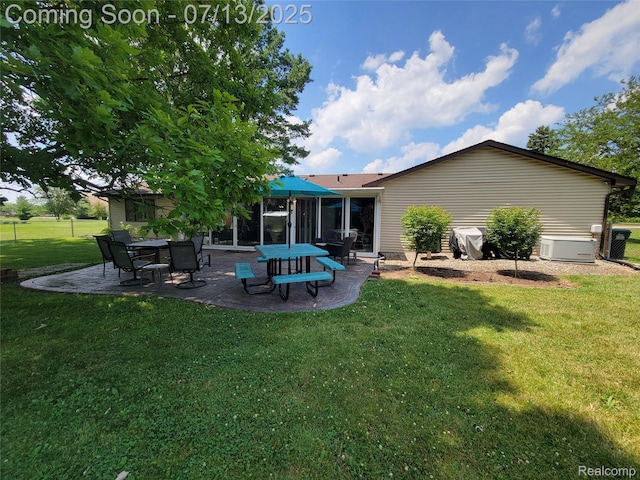 14373 Racho Blvd, Taylor, MI 48180 - back of house with a patio and a lawn