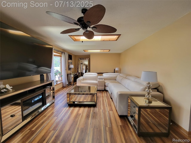 14373 Racho Blvd, Taylor, MI 48180 - living area with ceiling fan, wood finished floors, and a skylight