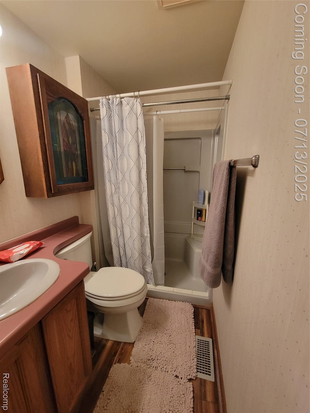 14373 Racho Blvd, Taylor, MI 48180 - full bathroom with wood finished floors, vanity, and curtained shower