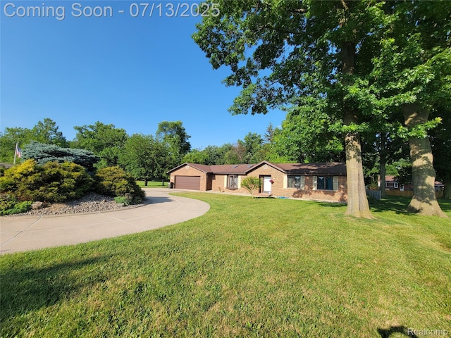 14373 Racho Blvd, Taylor, MI 48180 - single story home featuring a front lawn, driveway, and a garage
