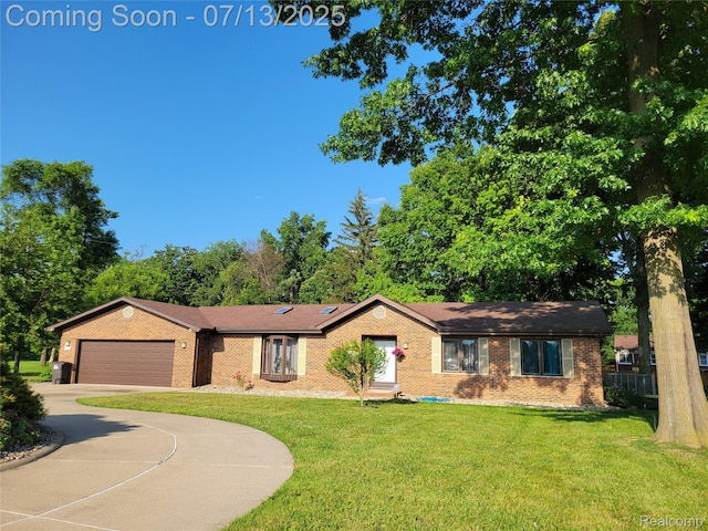 14373 Racho Blvd, Taylor, MI 48180 - ranch-style house featuring an attached garage, brick siding, and driveway