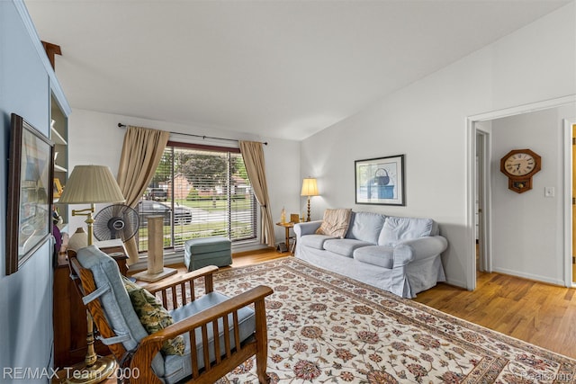 7396 N Charlesworth St, Dearborn Heights, MI 48127 - living room featuring lofted ceiling and light wood finished floors