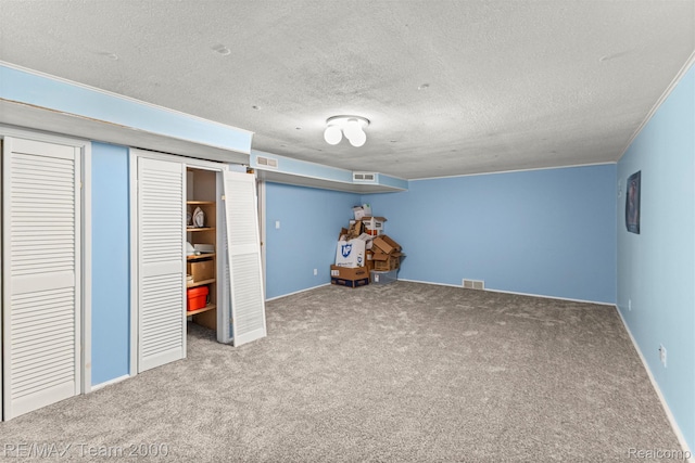 7396 N Charlesworth St, Dearborn Heights, MI 48127 - finished basement with carpet flooring and a textured ceiling