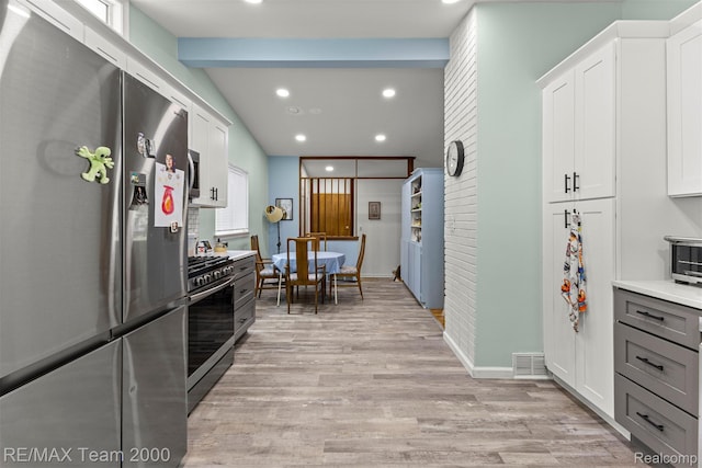 7396 N Charlesworth St, Dearborn Heights, MI 48127 - kitchen with stainless steel appliances, light wood-style floors, light countertops, white cabinets, and recessed lighting