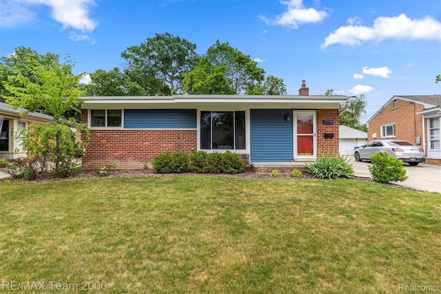 7396 N Charlesworth St, Dearborn Heights, MI 48127 - view of front facade featuring brick siding, a chimney, and a front lawn