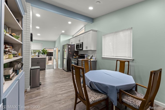 7396 N Charlesworth St, Dearborn Heights, MI 48127 - dining room with light wood finished floors and recessed lighting
