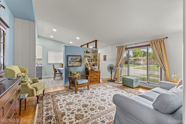 7396 N Charlesworth St, Dearborn Heights, MI 48127 - living area featuring vaulted ceiling, light wood-style floors, and recessed lighting