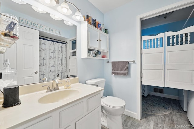 514 Sulley St, Waterford, MI 48327 - full bathroom with vanity, wood finished floors, and a shower with curtain