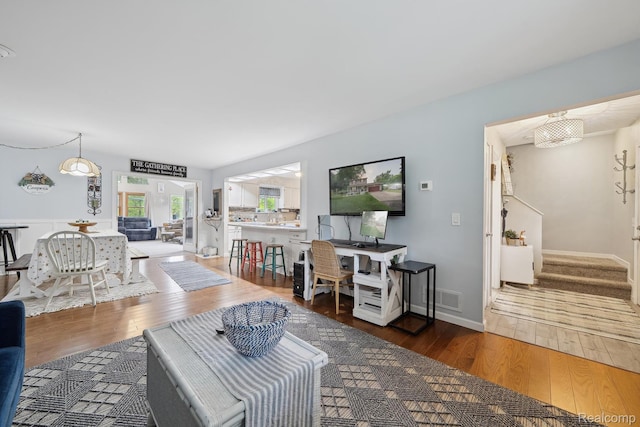 514 Sulley St, Waterford, MI 48327 - living area featuring wood finished floors and stairs
