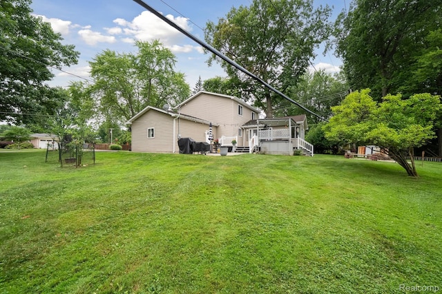 514 Sulley St, Waterford, MI 48327 - back of property featuring a wooden deck and a lawn