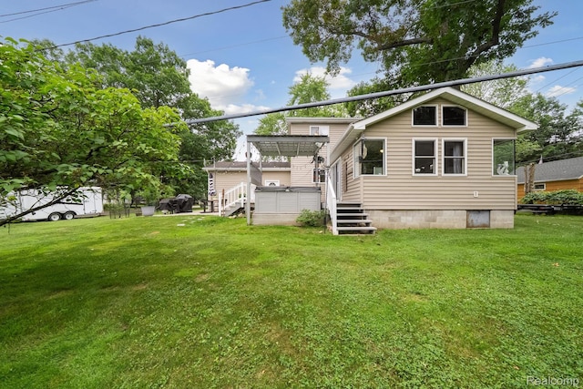 514 Sulley St, Waterford, MI 48327 - back of house featuring a yard and a wooden deck