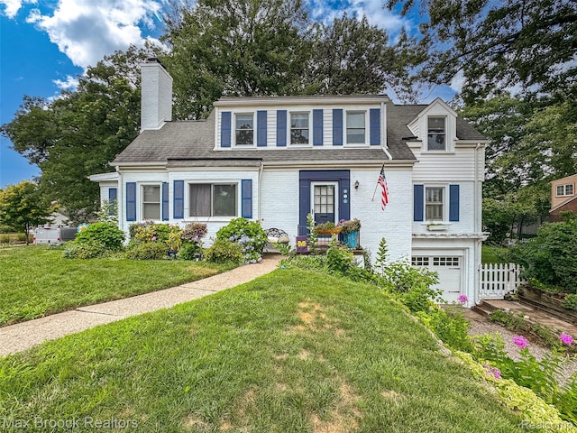 611 N Melborn St, Dearborn, MI 48128 - view of front facade with an attached garage, a chimney, driveway, and a shingled roof