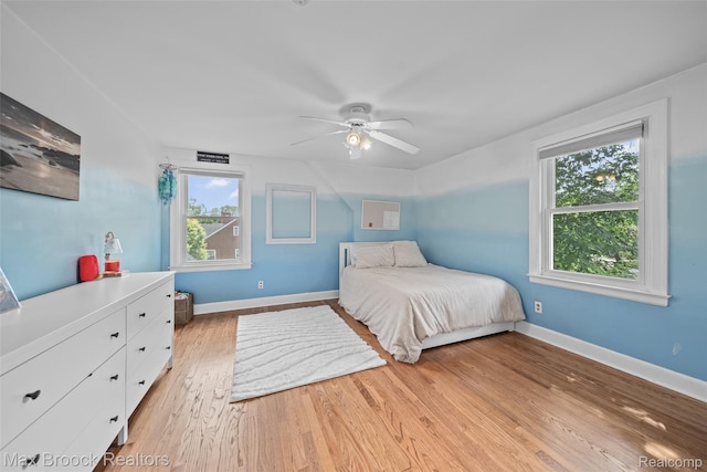 611 N Melborn St, Dearborn, MI 48128 - bedroom featuring multiple windows, light wood-style flooring, and a ceiling fan
