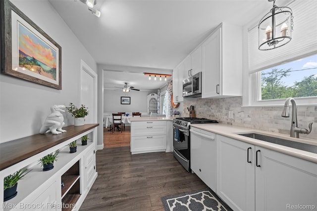 611 N Melborn St, Dearborn, MI 48128 - kitchen with gas range, healthy amount of natural light, backsplash, and stainless steel microwave