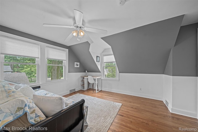 611 N Melborn St, Dearborn, MI 48128 - living area featuring ceiling fan, wood finished floors, and vaulted ceiling