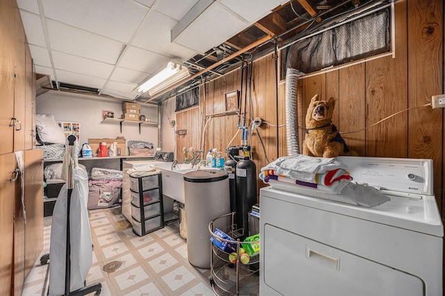 2820 Lowell St, Kalamazoo, MI 49001 - unfinished below grade area with washer / clothes dryer, a water softener, light floors, and wood walls