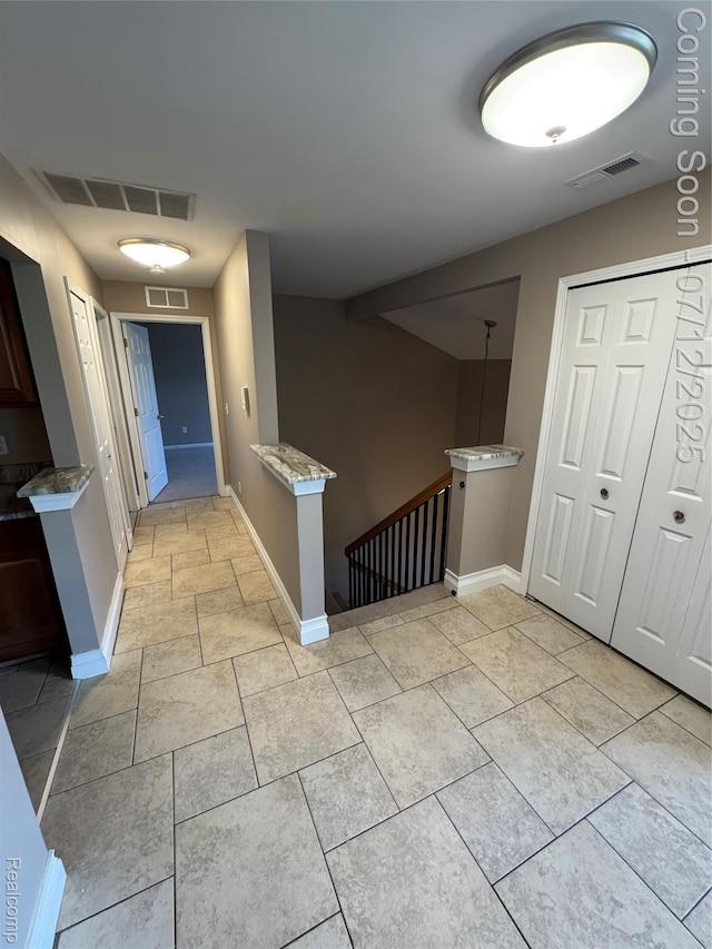 45562 Warwick Dr, Macomb, MI 48044 - corridor featuring an upstairs landing and light tile patterned flooring