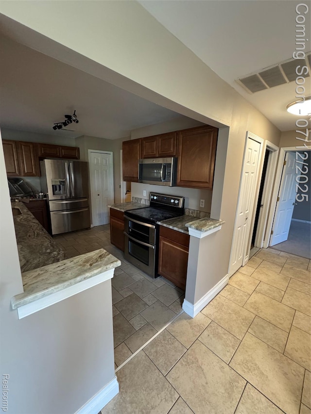 45562 Warwick Dr, Macomb, MI 48044 - kitchen featuring stainless steel appliances and light stone counters