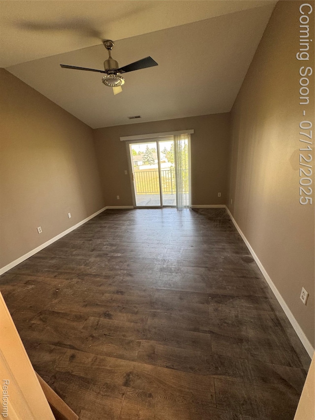 45562 Warwick Dr, Macomb, MI 48044 - spare room with vaulted ceiling, a ceiling fan, and dark wood-type flooring