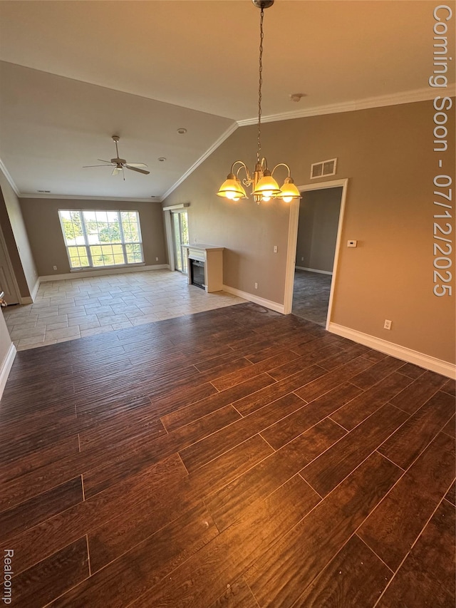 45562 Warwick Dr, Macomb, MI 48044 - unfurnished living room featuring wood finished floors, ornamental molding, ceiling fan, a chandelier, and vaulted ceiling