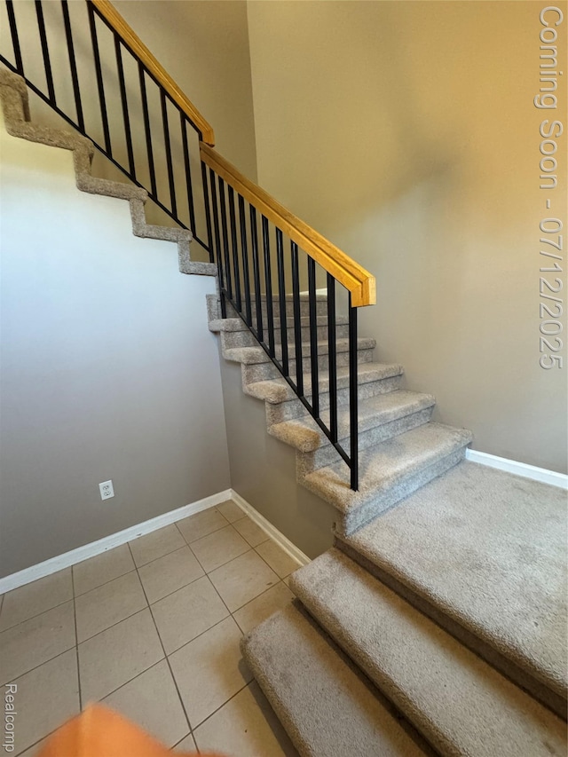 45562 Warwick Dr, Macomb, MI 48044 - stairway featuring baseboards and tile patterned flooring