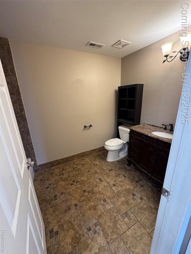 45562 Warwick Dr, Macomb, MI 48044 - bathroom featuring vanity and stone finish flooring