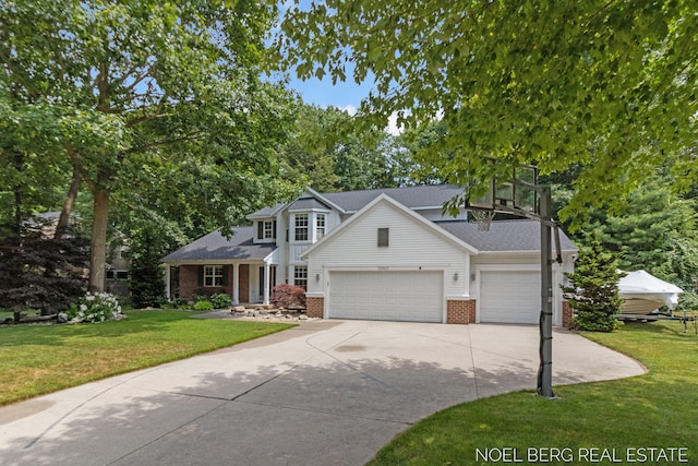 13462 Ravine View Dr, Grand Haven, MI 49417 - traditional home with brick siding, concrete driveway, a front lawn, and a garage