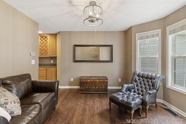 13462 Ravine View Dr, Grand Haven, MI 49417 - living room featuring dark wood finished floors and a chandelier