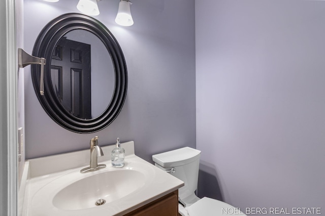 13462 Ravine View Dr, Grand Haven, MI 49417 - half bathroom featuring toilet and vanity
