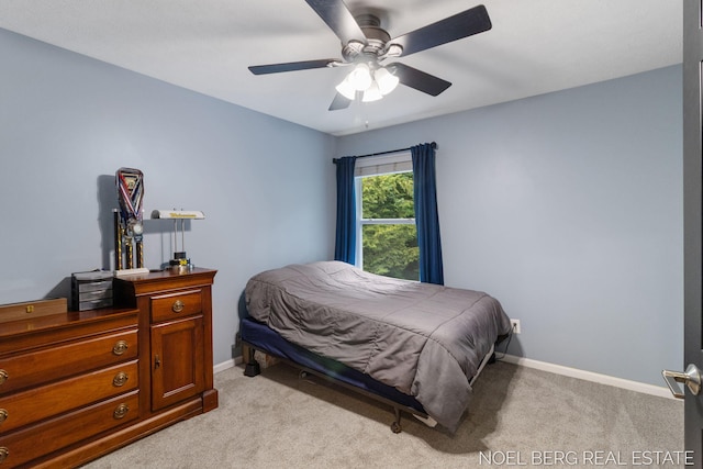 13462 Ravine View Dr, Grand Haven, MI 49417 - bedroom with light colored carpet and ceiling fan