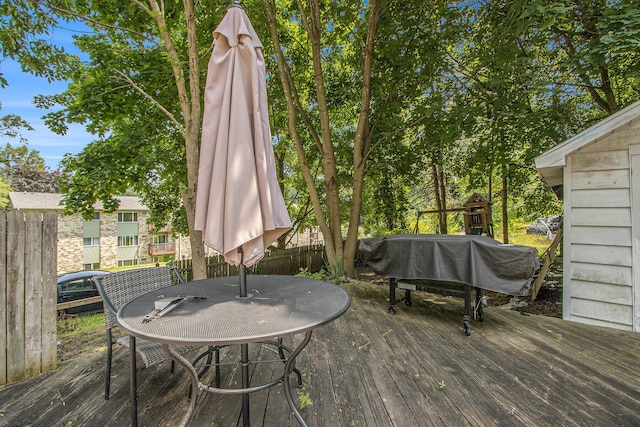54 Wren St, Battle Creek, MI 49017 - wooden terrace with grilling area and outdoor dining space