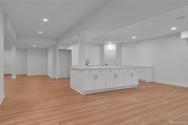 4627 Cimarron Dr, Bloomfield Hills, MI 48302 - kitchen featuring light wood-type flooring, white cabinetry, recessed lighting, and light countertops