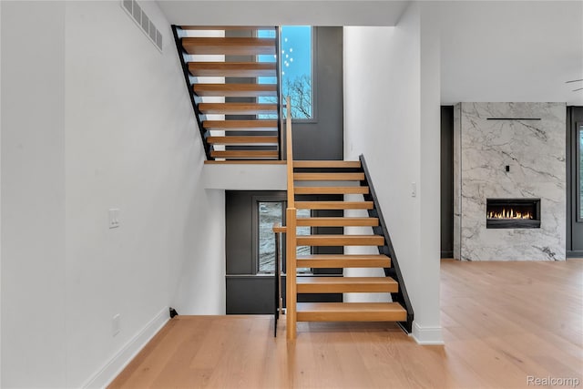 4627 Cimarron Dr, Bloomfield Hills, MI 48302 - stairway with wood finished floors and a high end fireplace