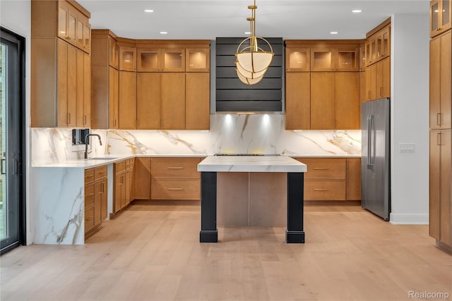 4627 Cimarron Dr, Bloomfield Hills, MI 48302 - kitchen with stainless steel fridge, decorative backsplash, exhaust hood, recessed lighting, and glass insert cabinets