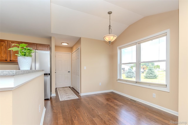 16017 Whippoorwill Ct, Manchester, MI 48158 - unfurnished dining area with dark wood-style flooring and lofted ceiling