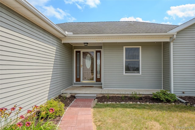 16017 Whippoorwill Ct, Manchester, MI 48158 - property entrance featuring a shingled roof and a lawn