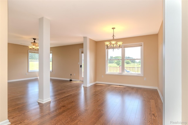 16017 Whippoorwill Ct, Manchester, MI 48158 - empty room with a chandelier, plenty of natural light, and dark wood finished floors