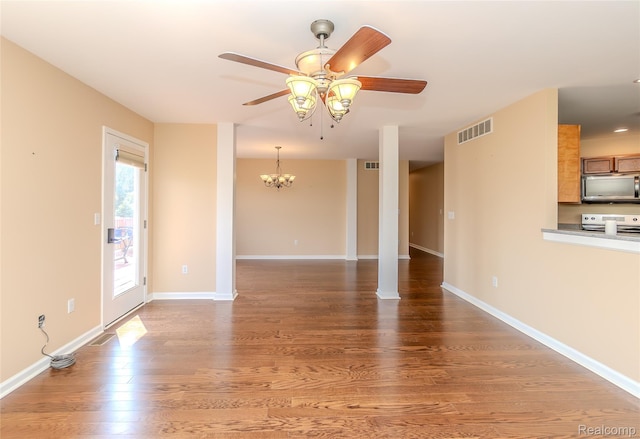 16017 Whippoorwill Ct, Manchester, MI 48158 - unfurnished living room featuring a ceiling fan, wood finished floors, and a chandelier